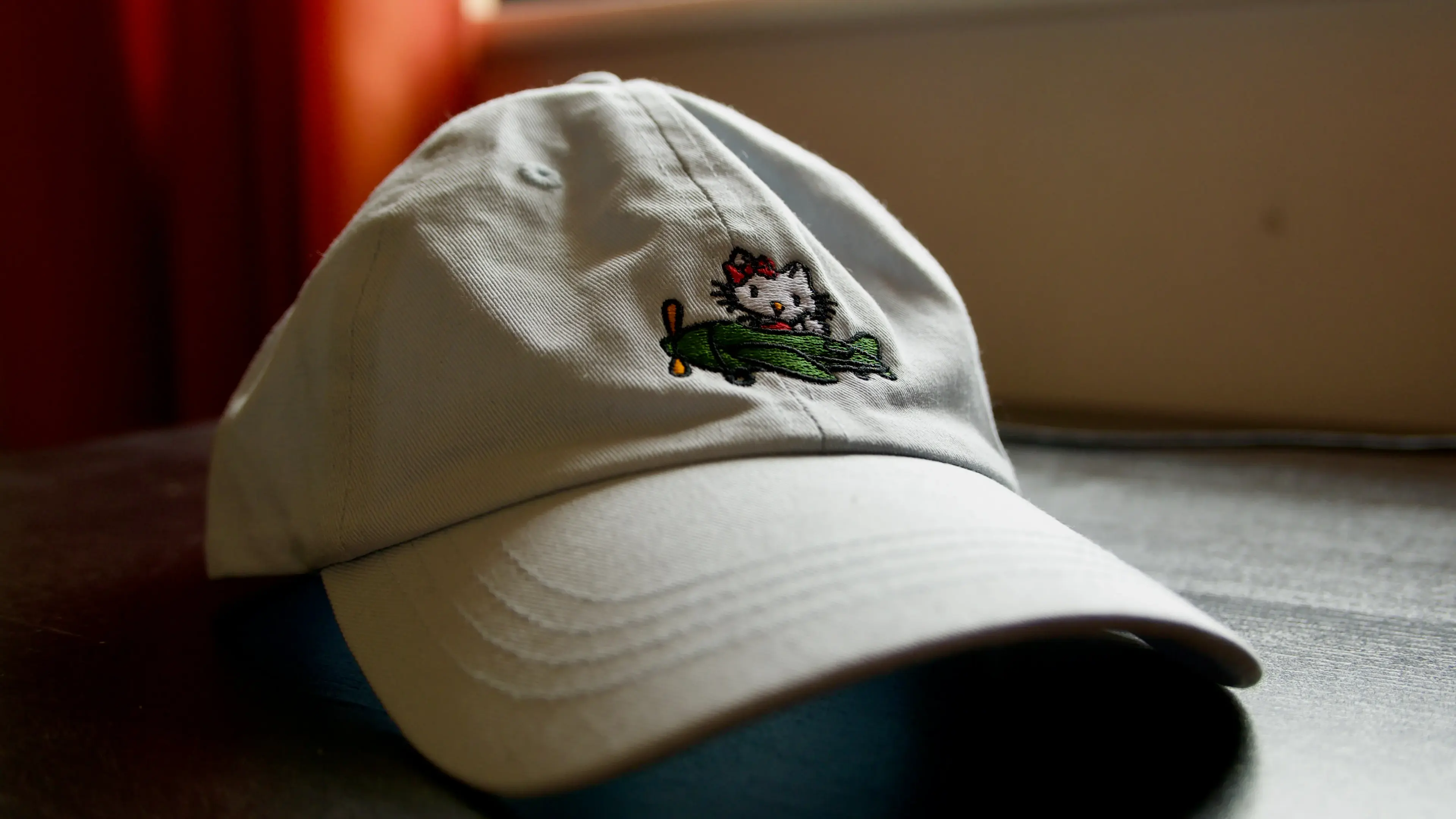 A cap depicting Hello Kitty attacking Pearl Harbour